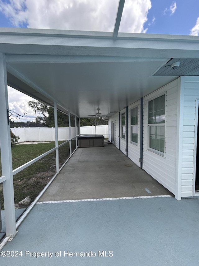 view of car parking featuring a yard and a carport