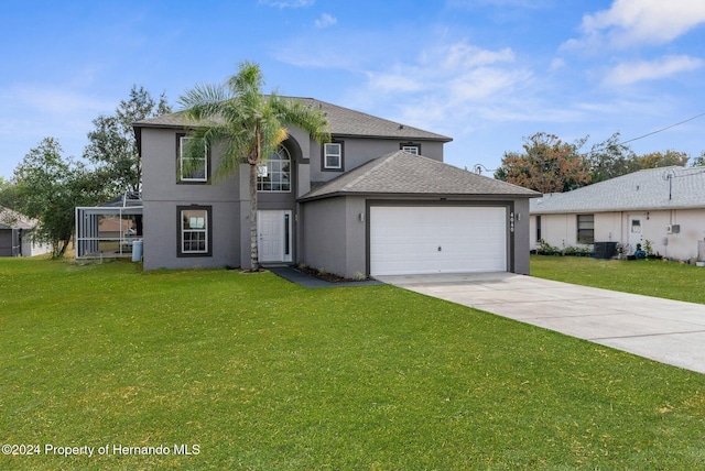 view of front of house with a garage and a front yard