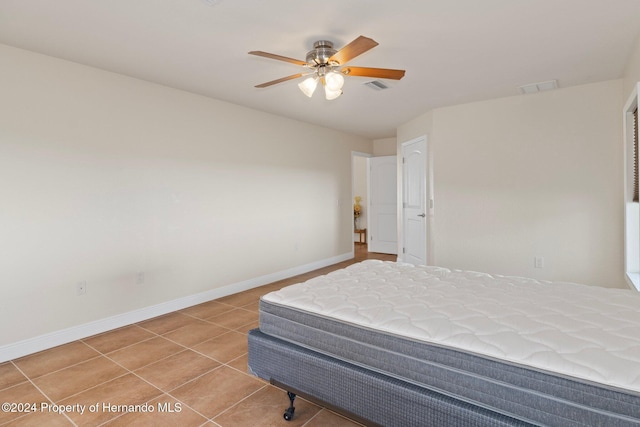 bedroom featuring tile patterned floors and ceiling fan