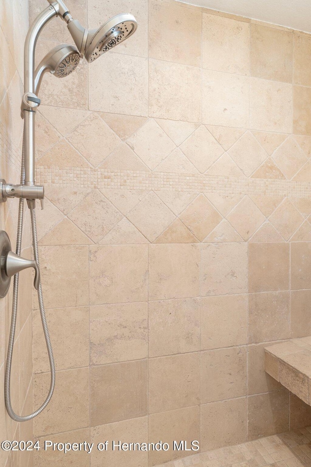 details featuring a tile shower