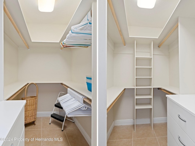 walk in closet featuring light tile patterned floors