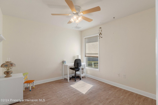 unfurnished office featuring ceiling fan and light wood-type flooring