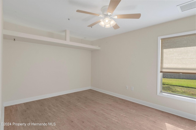 unfurnished room featuring ceiling fan and light wood-type flooring