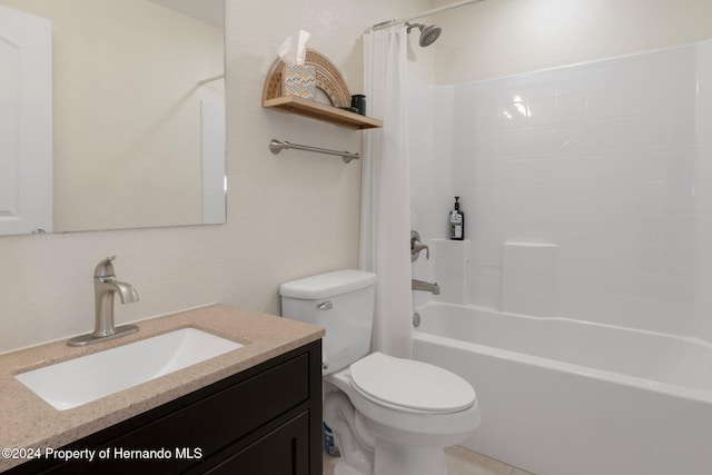 full bathroom with vanity, toilet, and shower / tub combo with curtain