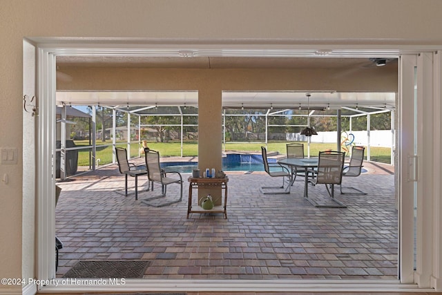 view of patio / terrace with glass enclosure