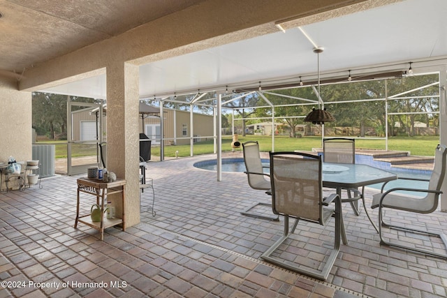 view of patio / terrace featuring a lanai