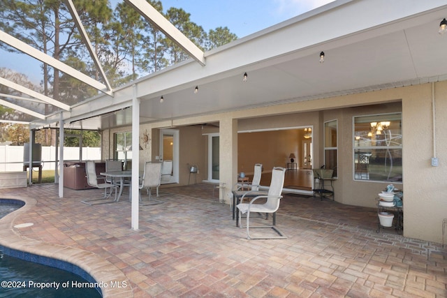 sunroom featuring beam ceiling