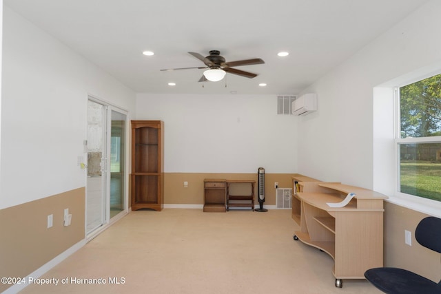 office space with ceiling fan, light colored carpet, and a wall mounted AC