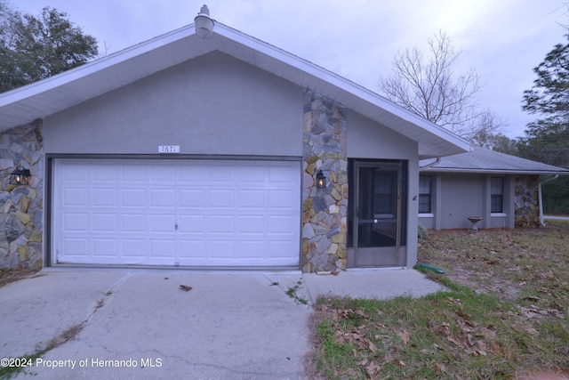 single story home featuring a garage