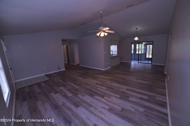 unfurnished living room featuring hardwood / wood-style floors, ceiling fan, lofted ceiling, and sink