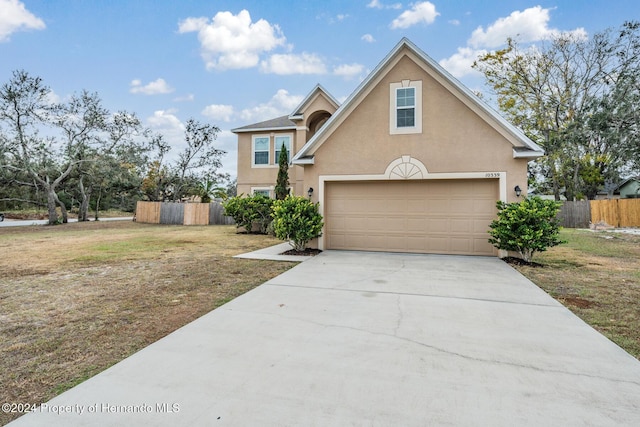 front of property with a garage