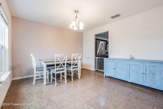 dining room featuring an inviting chandelier