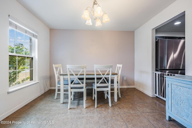 unfurnished dining area featuring a notable chandelier