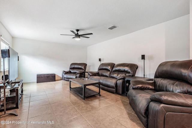 tiled living room with ceiling fan