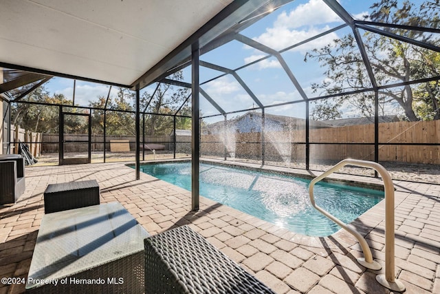 view of swimming pool featuring a lanai, a patio, and central AC unit