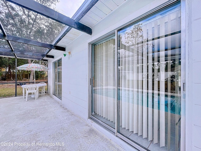 doorway to property with a patio