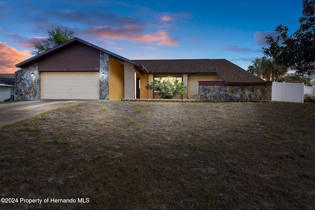 ranch-style home with a garage