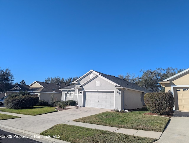 single story home with a garage and a front yard