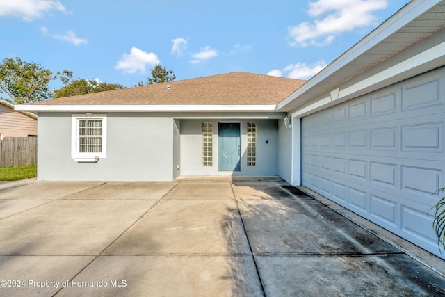 single story home with a garage