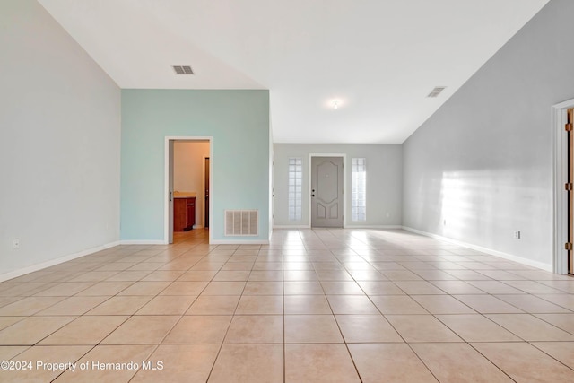 spare room featuring light tile patterned floors