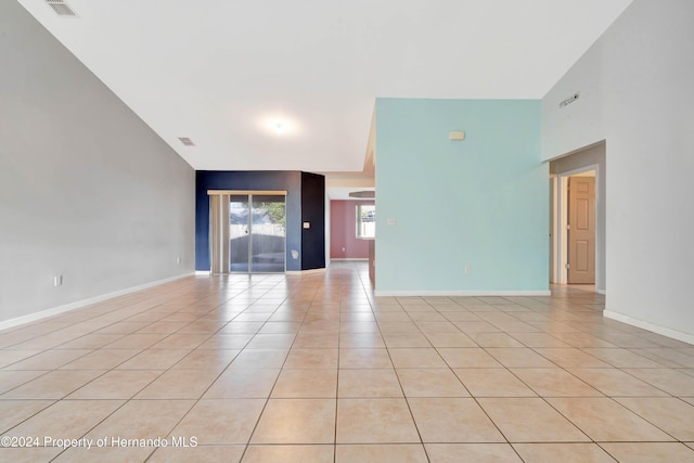 unfurnished room with light tile patterned flooring