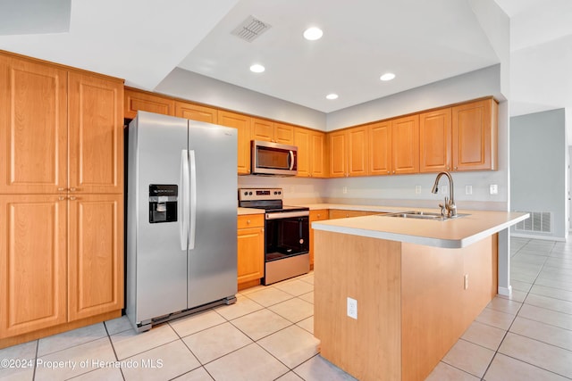 kitchen featuring kitchen peninsula, light tile patterned floors, sink, and appliances with stainless steel finishes