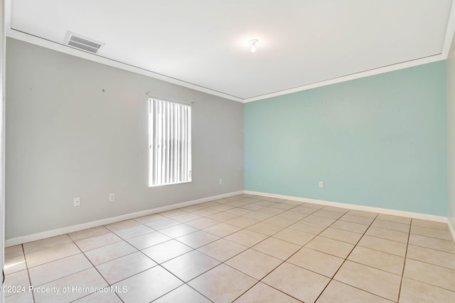 tiled empty room with ornamental molding