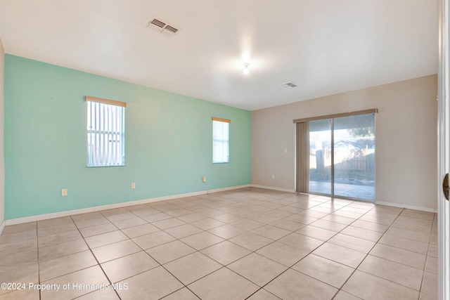 spare room with light tile patterned flooring