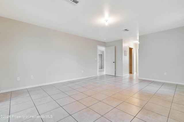 spare room with light tile patterned flooring