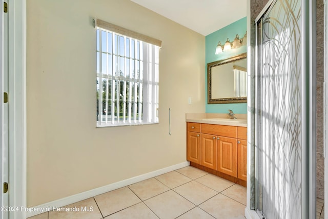 bathroom with tile patterned flooring and vanity