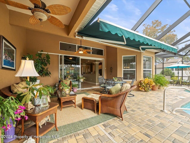 view of patio / terrace featuring ceiling fan