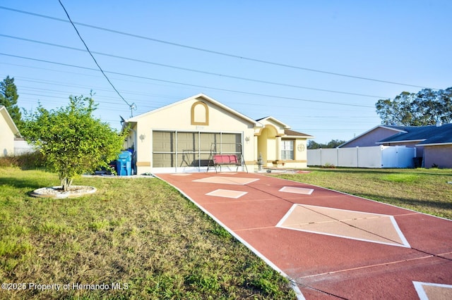 view of front of home with a front lawn