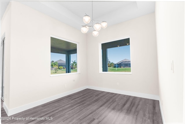 spare room featuring a notable chandelier