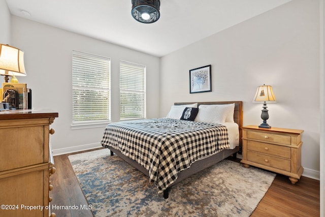 bedroom featuring dark wood-type flooring