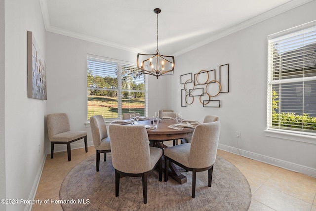 tiled dining room with crown molding, a healthy amount of sunlight, and an inviting chandelier