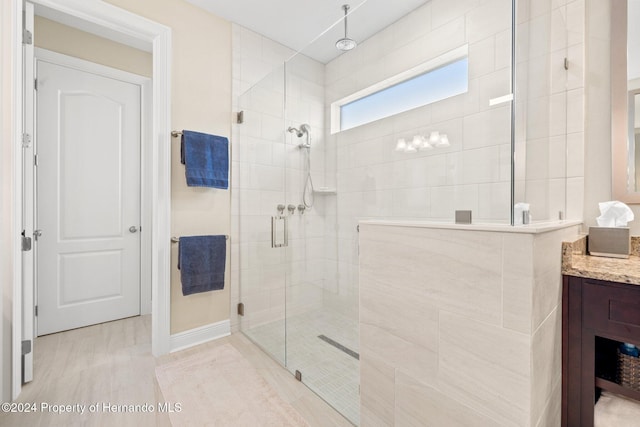 bathroom with vanity and an enclosed shower