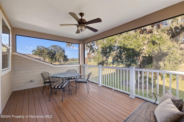 sunroom / solarium with ceiling fan