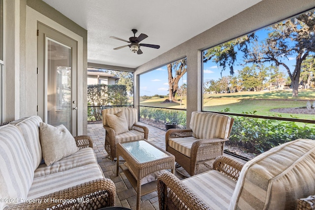 sunroom / solarium with ceiling fan