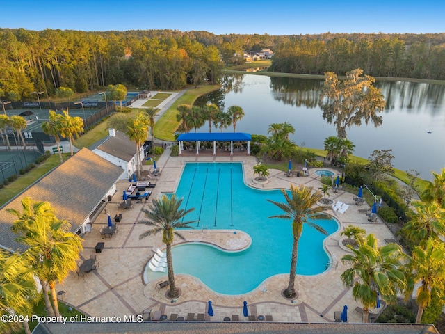 view of pool featuring a water view