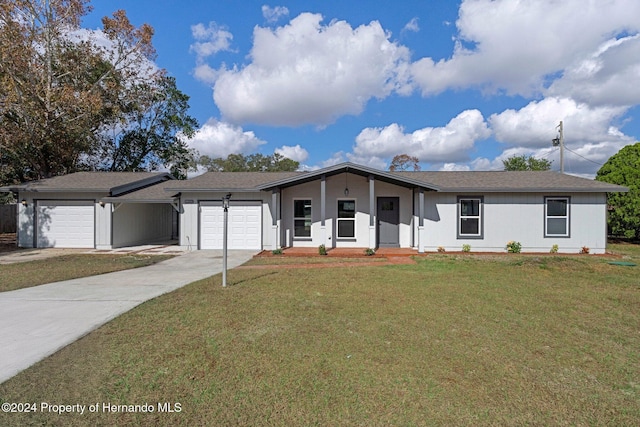 ranch-style house with a front lawn and a garage