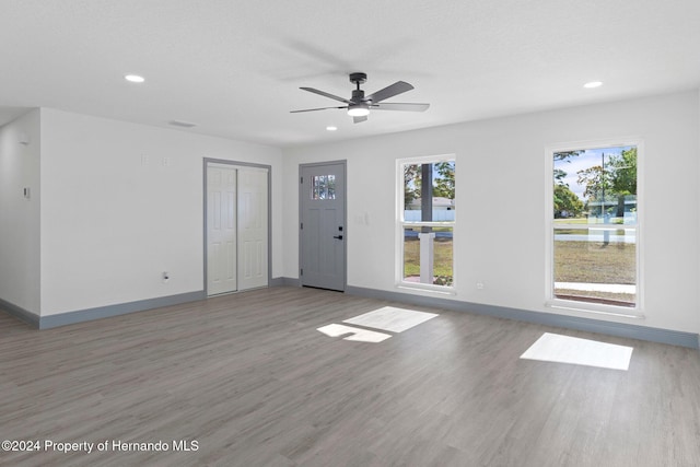 empty room featuring ceiling fan and wood-type flooring