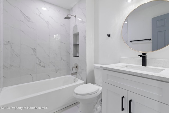 full bathroom with vanity, tiled shower / bath combo, and toilet