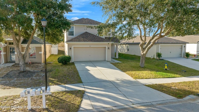 view of front of house with a front lawn and a garage