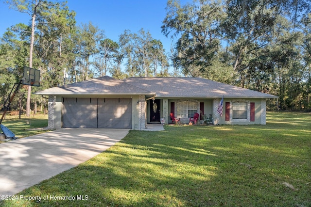 single story home with a garage and a front yard