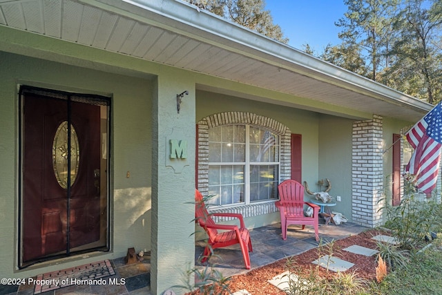 entrance to property with covered porch