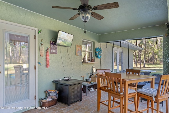 sunroom / solarium with ceiling fan