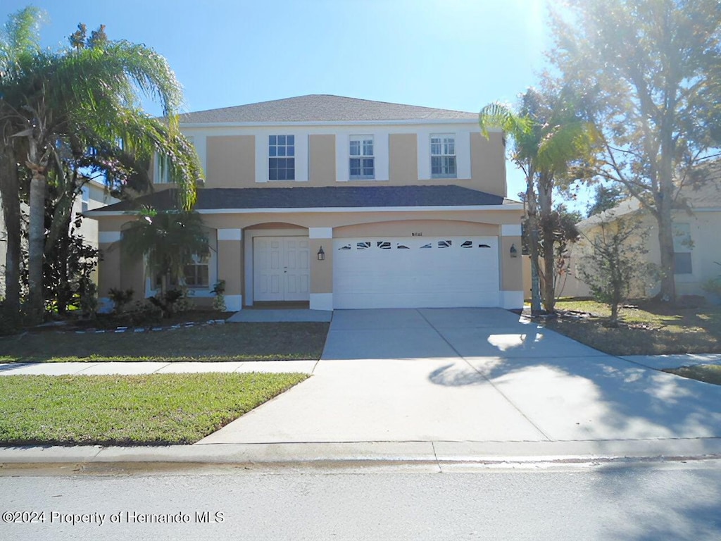 view of front of home with a garage