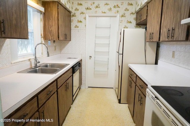 kitchen with stainless steel dishwasher and sink