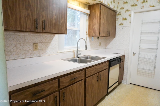 kitchen featuring sink and white dishwasher