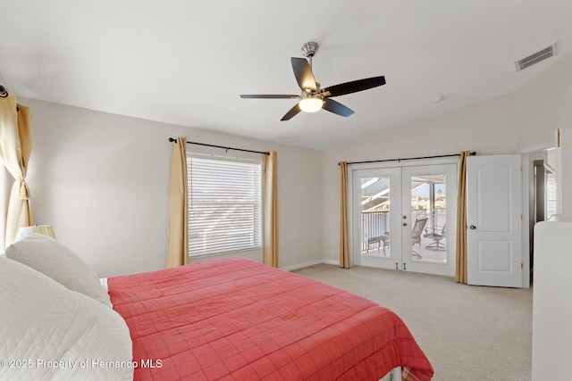 bedroom featuring french doors, light colored carpet, vaulted ceiling, ceiling fan, and access to exterior